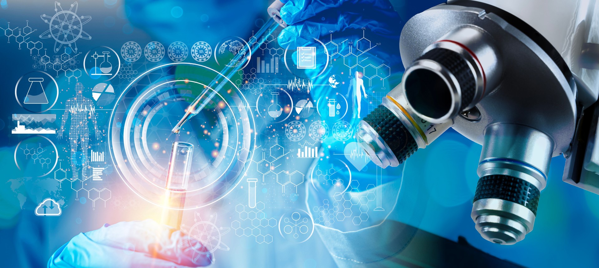 Medical research laboratory. A scientist works with a pipette and a test tube.